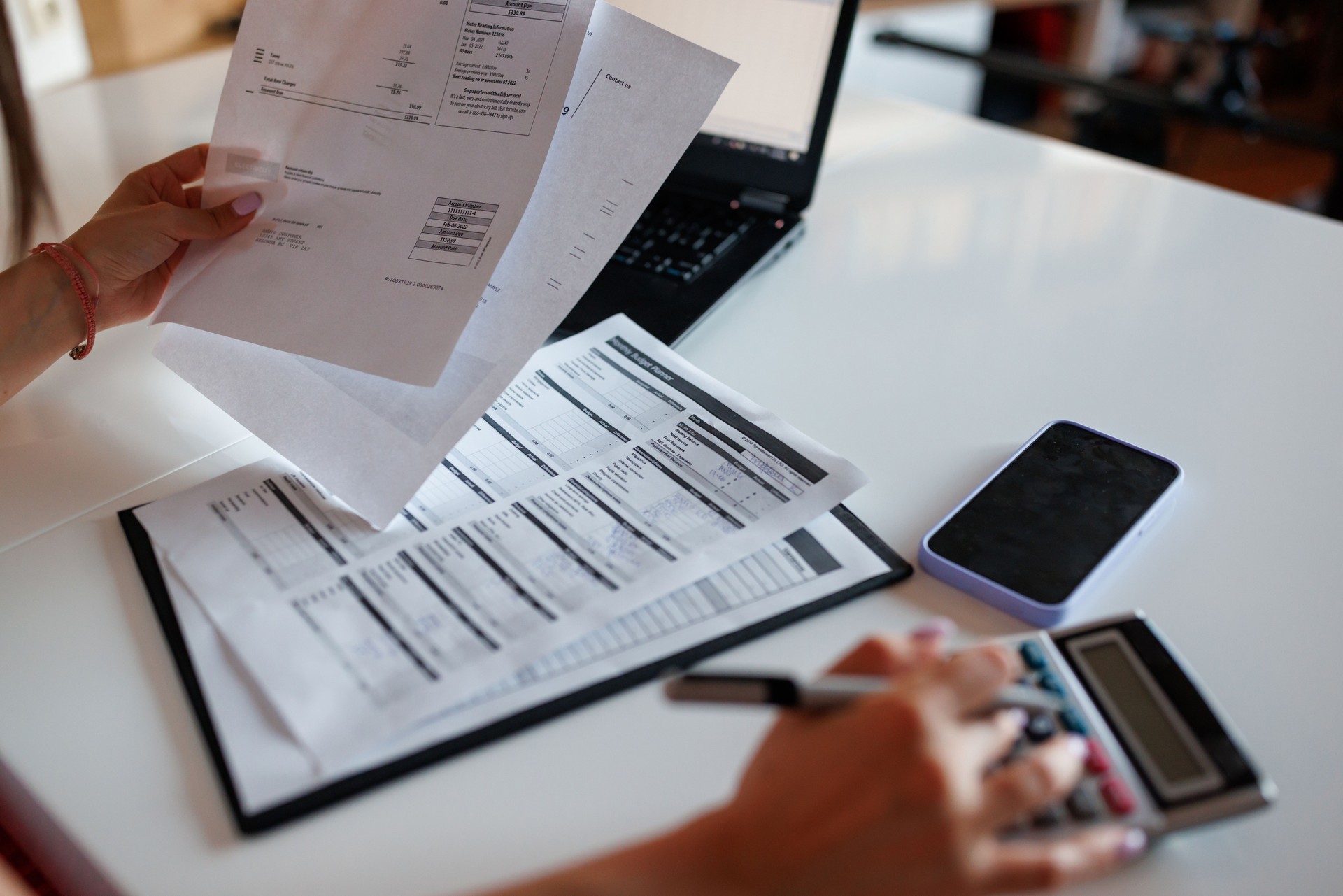 Woman paying bills from home